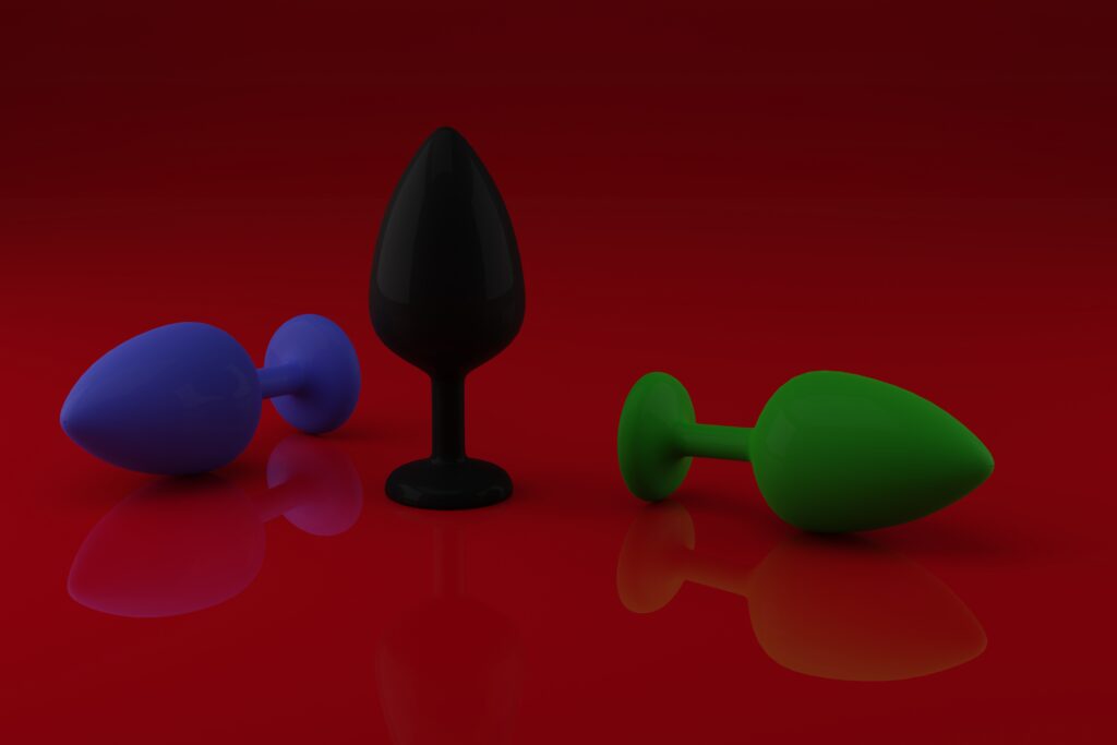 anal plugs toys adults different colors red background sex shop intimate entertainment concept 3d render