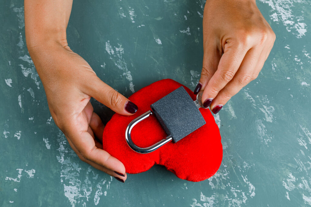 celebration concept woman locking toy heart